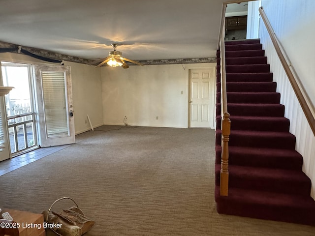 interior space featuring ceiling fan