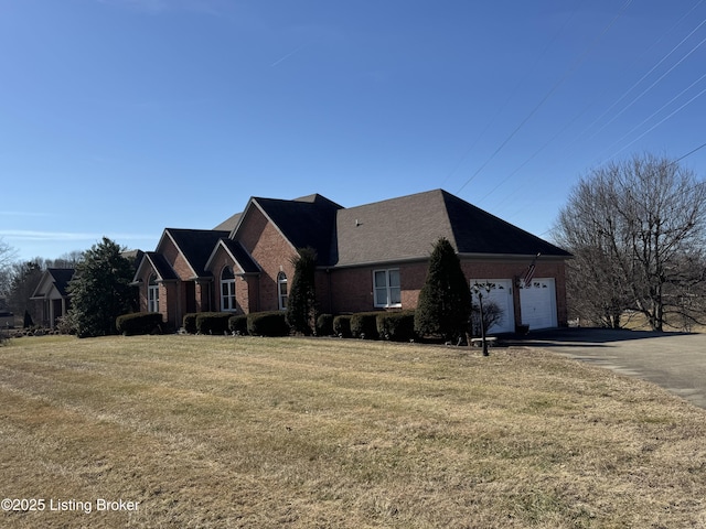 view of front of house with a garage and a front yard