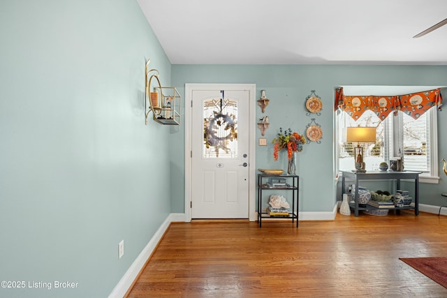 entryway with hardwood / wood-style floors