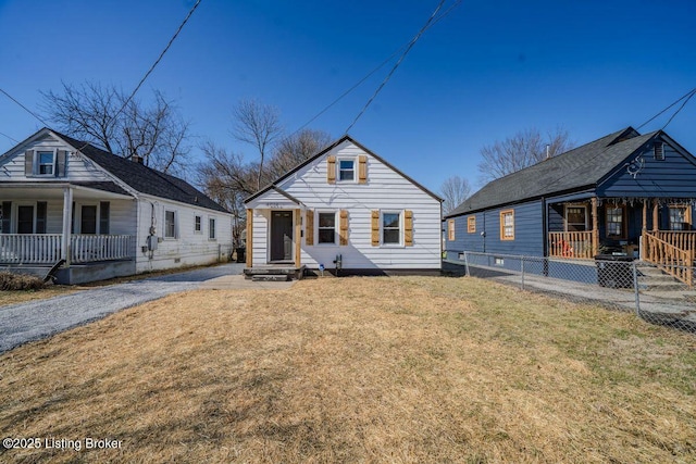 bungalow with a porch and a front yard