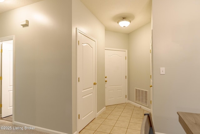 foyer entrance featuring light tile patterned floors