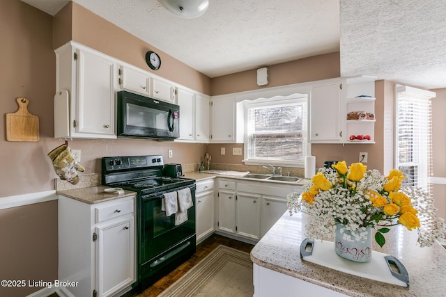 kitchen with open shelves, white cabinets, a sink, a textured ceiling, and black appliances