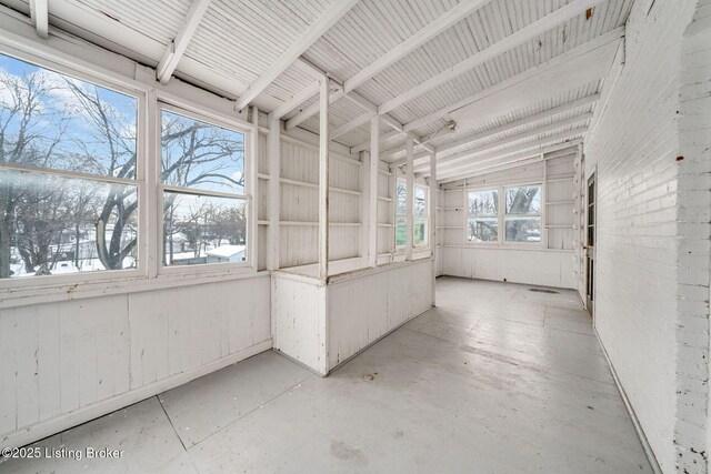 unfurnished sunroom with plenty of natural light