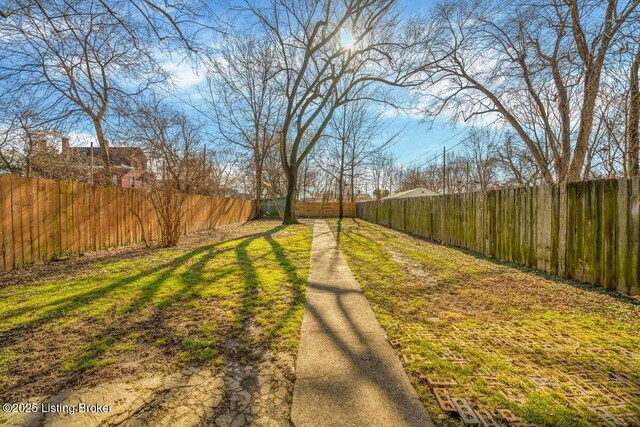 view of yard with a fenced backyard