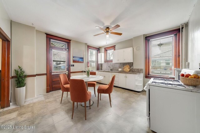 dining room with a ceiling fan