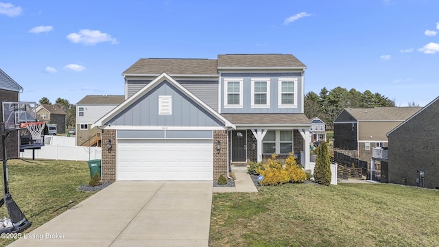 view of front of property featuring brick siding, board and batten siding, a front lawn, fence, and concrete driveway