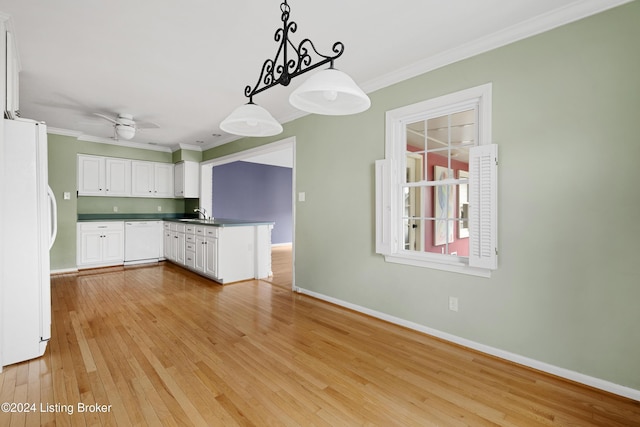 kitchen featuring crown molding, hanging light fixtures, white appliances, light hardwood / wood-style floors, and white cabinets