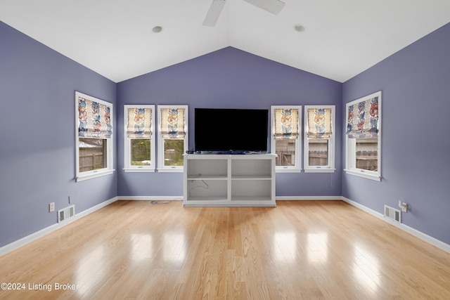 unfurnished living room featuring ceiling fan, lofted ceiling, and light hardwood / wood-style floors