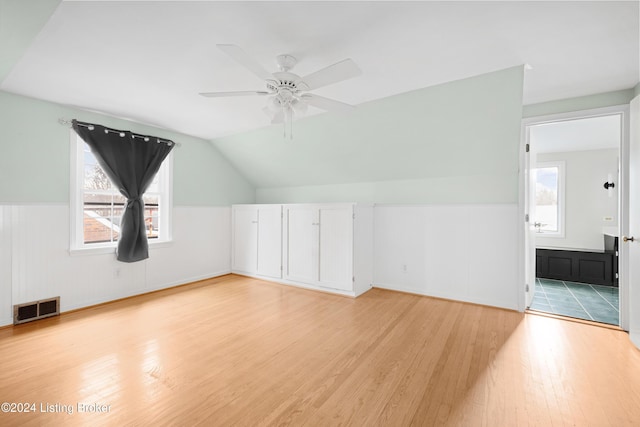 bonus room featuring vaulted ceiling, ceiling fan, and light wood-type flooring