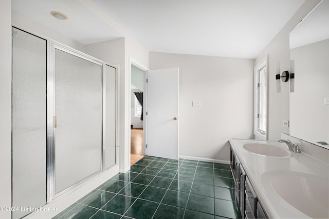 bathroom with tile patterned flooring, vanity, and a shower with shower door