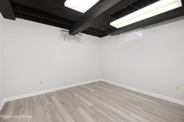 basement featuring light hardwood / wood-style flooring