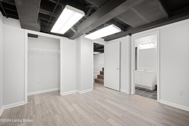 basement with wood-type flooring