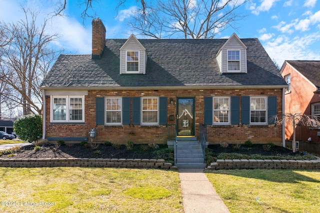 cape cod house with a front lawn