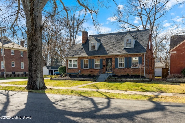 cape cod home featuring a front lawn