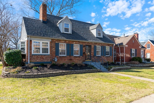 cape cod-style house with a front lawn