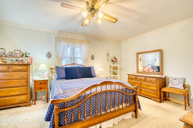 carpeted bedroom featuring crown molding and ceiling fan