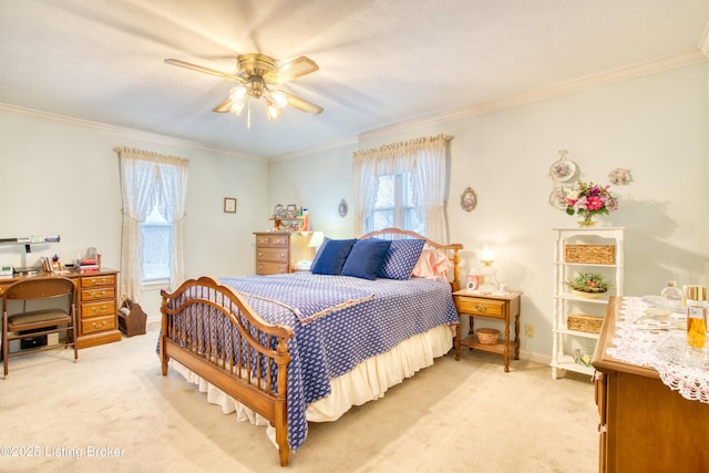 bedroom featuring crown molding, light carpet, and ceiling fan