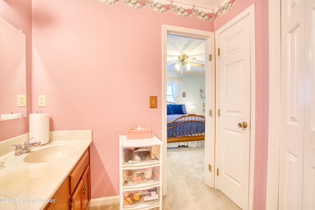 bathroom featuring ceiling fan and vanity