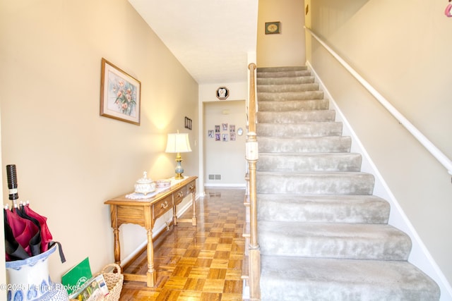 staircase with parquet floors