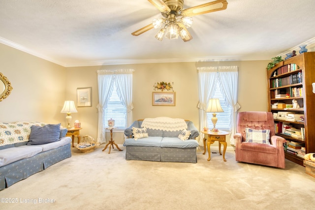 carpeted living room with a textured ceiling, plenty of natural light, ornamental molding, and ceiling fan