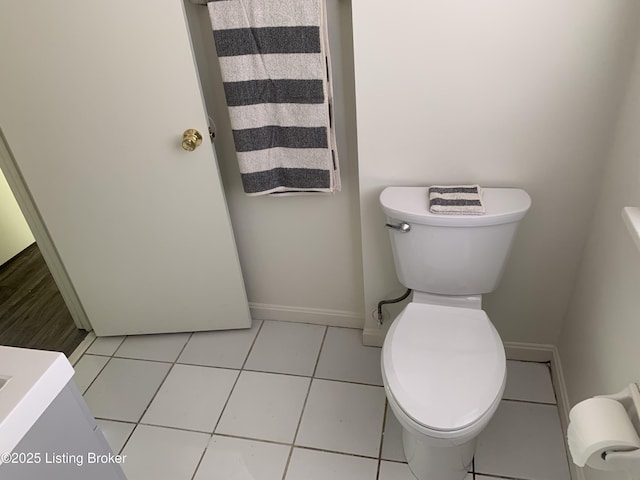 bathroom featuring tile patterned floors and toilet