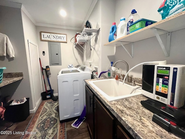 laundry area featuring sink, crown molding, cabinets, electric panel, and independent washer and dryer