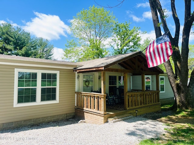 view of front of property with a porch and crawl space
