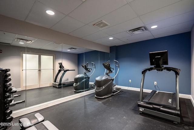 workout area with a drop ceiling