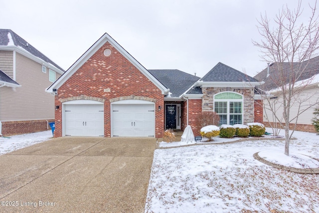 view of front of house featuring brick siding, a shingled roof, an attached garage, and driveway