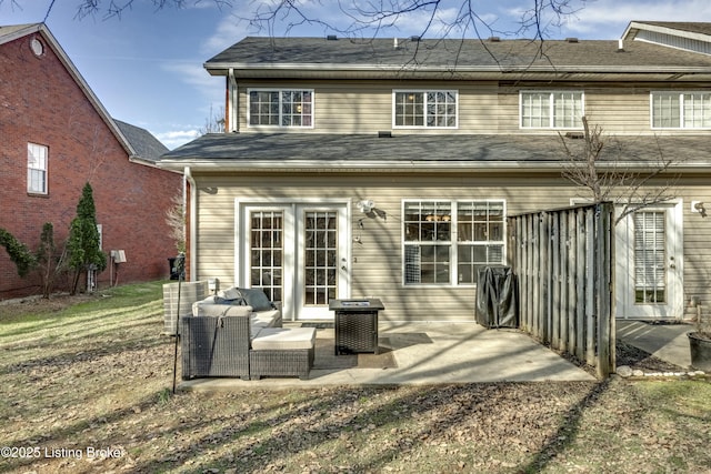 rear view of house featuring a patio and outdoor lounge area