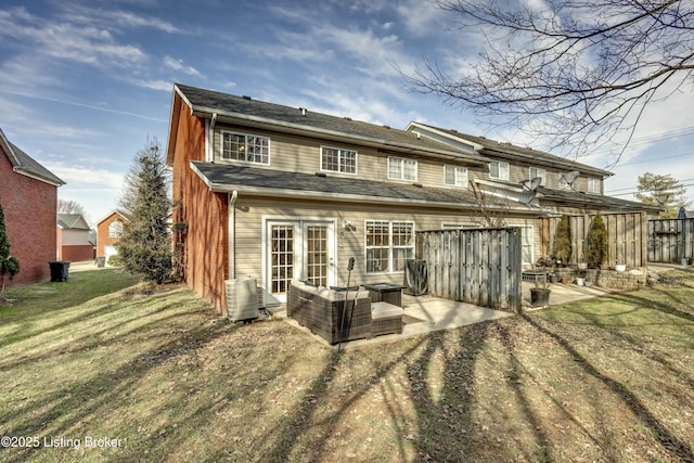 back of house with a yard, central AC unit, and a patio area