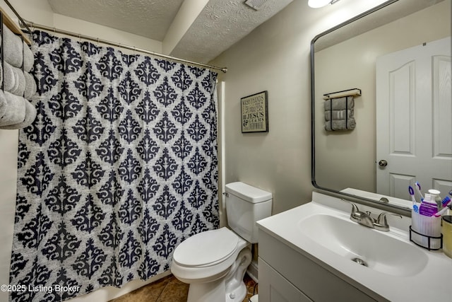 bathroom with tile patterned flooring, vanity, toilet, a textured ceiling, and a shower with shower curtain