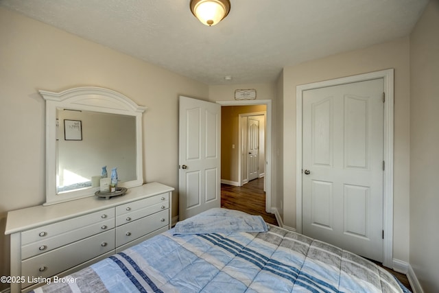 bedroom featuring dark hardwood / wood-style flooring