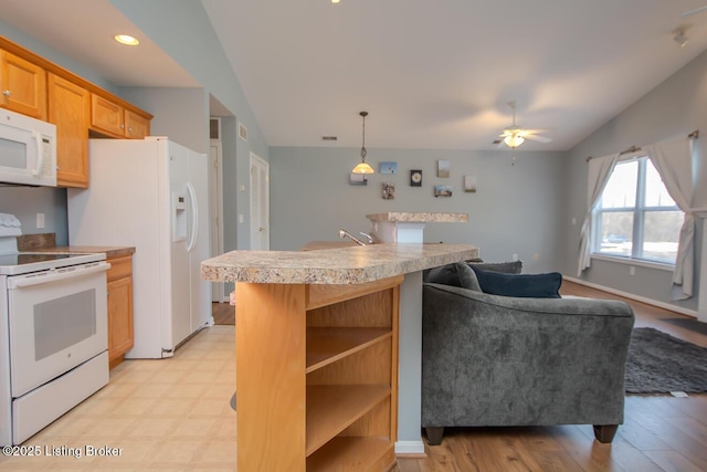 kitchen featuring pendant lighting, lofted ceiling, white appliances, ceiling fan, and light brown cabinets