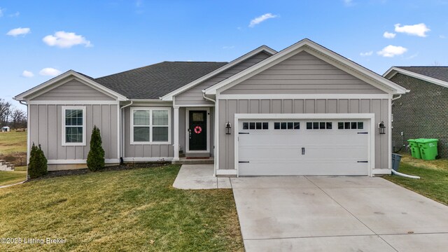 view of front of property featuring a garage and a front yard