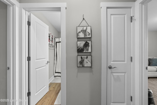 corridor featuring light wood-type flooring