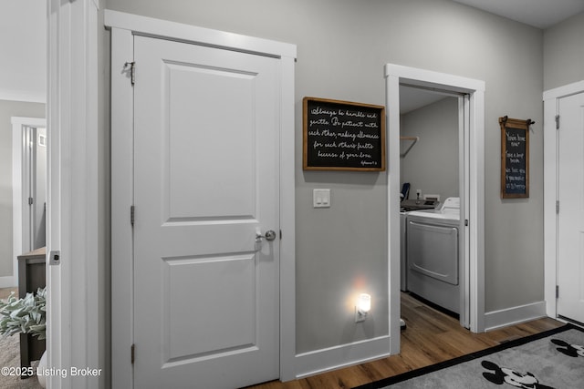 washroom featuring separate washer and dryer and dark hardwood / wood-style floors