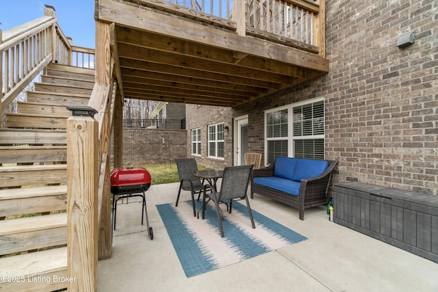 view of patio featuring a balcony and grilling area