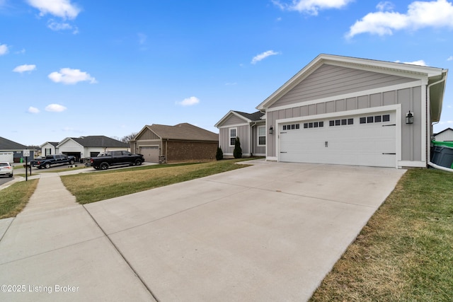 ranch-style house featuring a garage and a front lawn