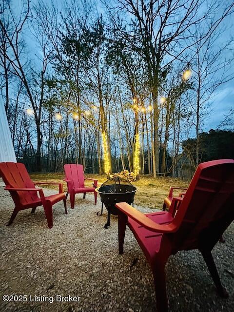 view of yard featuring a fire pit