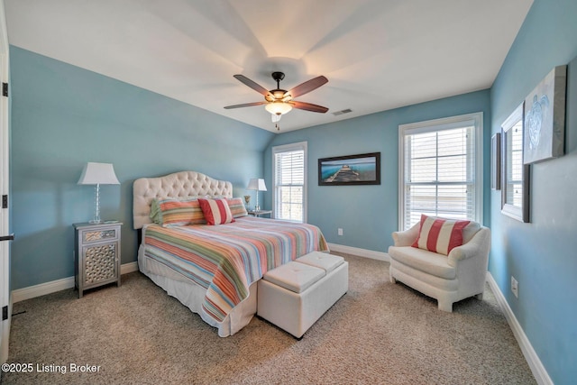 bedroom featuring visible vents, baseboards, carpet, and ceiling fan