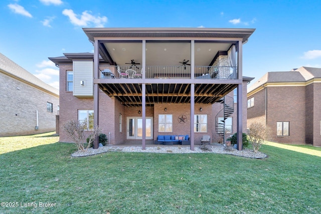 back of house with stairway, a lawn, a ceiling fan, and a patio area