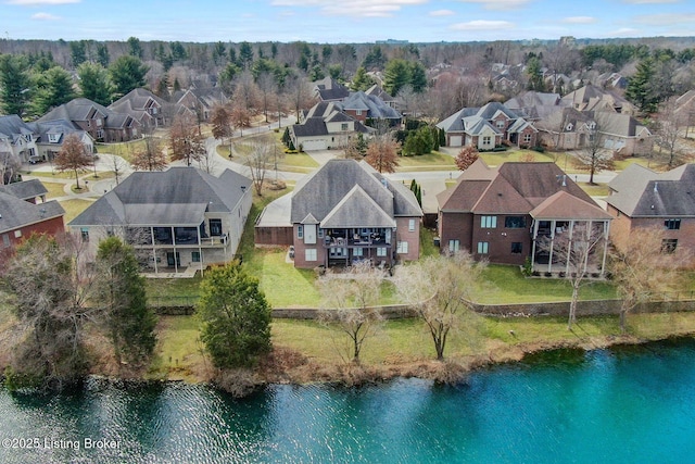 drone / aerial view with a residential view and a water view