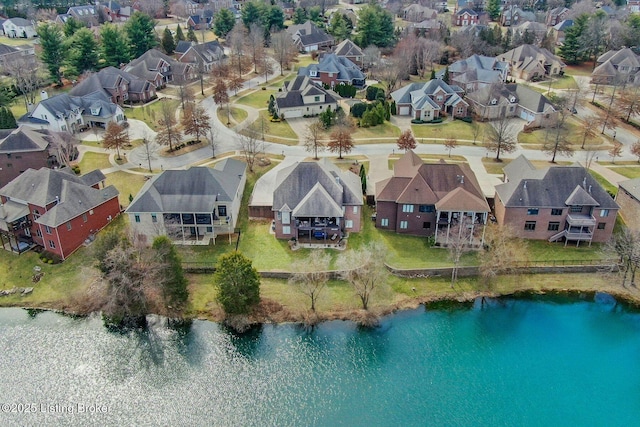 bird's eye view with a residential view and a water view