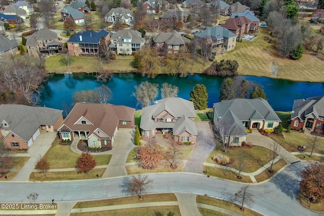 birds eye view of property featuring a residential view and a water view