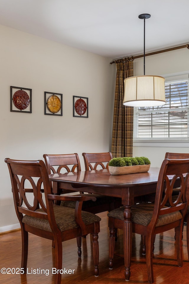 dining area featuring wood-type flooring