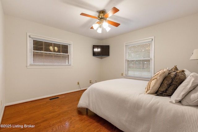 bedroom featuring wood-type flooring and ceiling fan