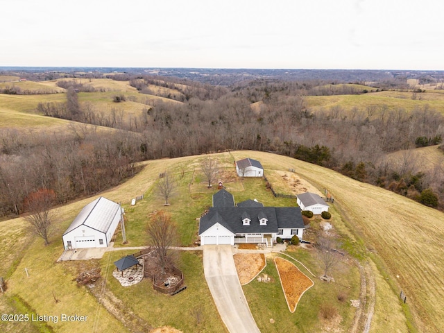 birds eye view of property with a rural view