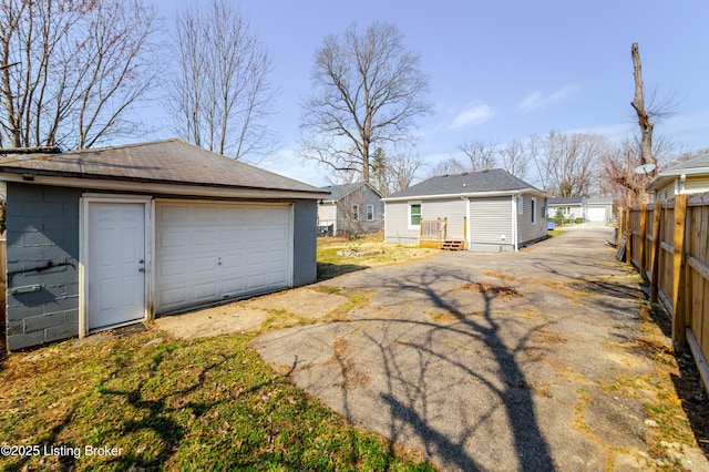 garage featuring fence