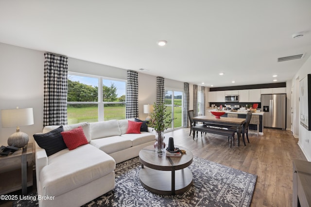 living room with light hardwood / wood-style flooring